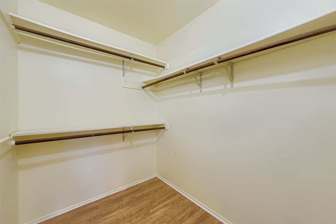 3104 Dominic Drive Austin, TX 78745 - Photo 18 of 28 Walk in closet featuring light wood finished floors