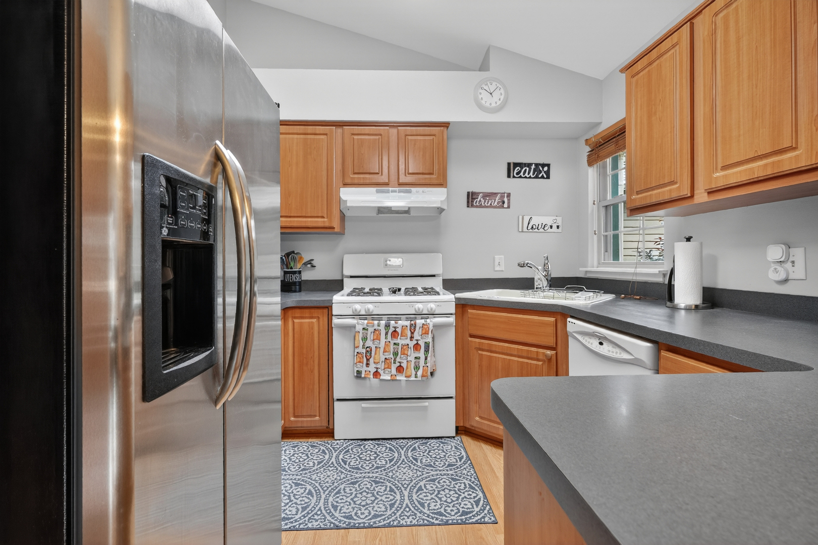 943 Ridgefield Lane, Unit 4 Wheeling, IL 60090 - Photo 11 of 38 a kitchen with stainless steel appliances granite countertop a refrigerator a stove and a sink