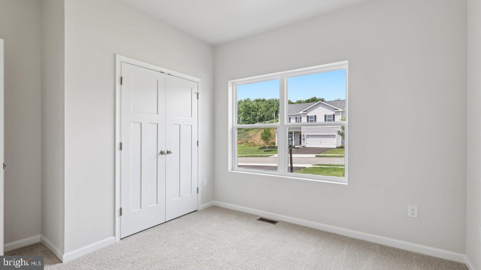 2042 Paperback Way York, PA 17408 - Photo 3 of 13 an empty room with windows and closet