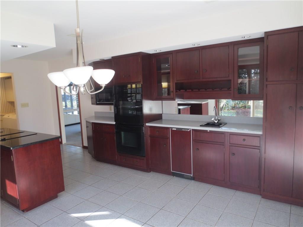 3680 McConnell Road Hermitage, PA 16148 - Photo 10 of 24 Cherry kitchen with island and appliance package.