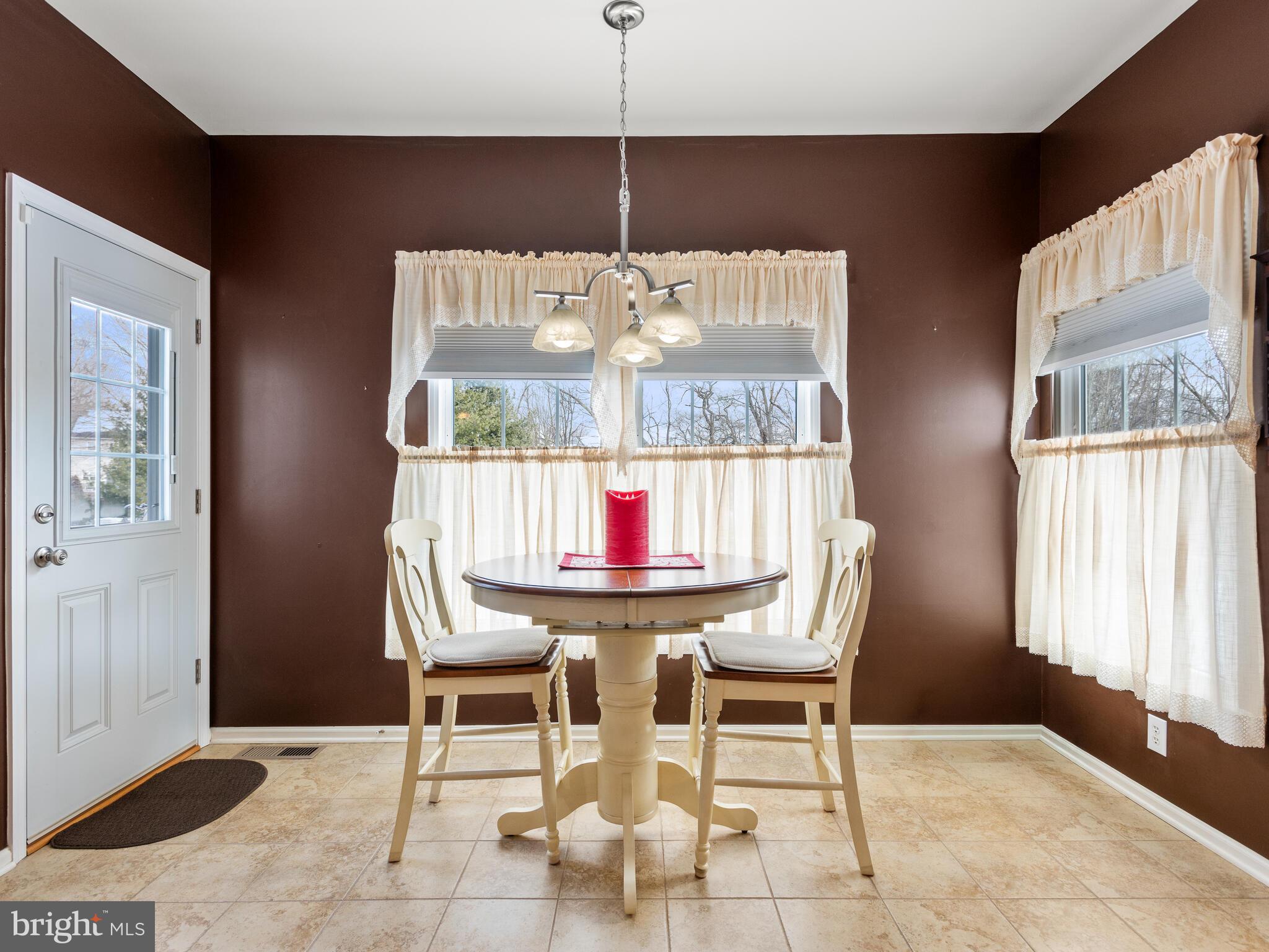 105 Hydrangea Way Coatesville, PA 19320 - Photo 12 of 26 a dining room with furniture and window