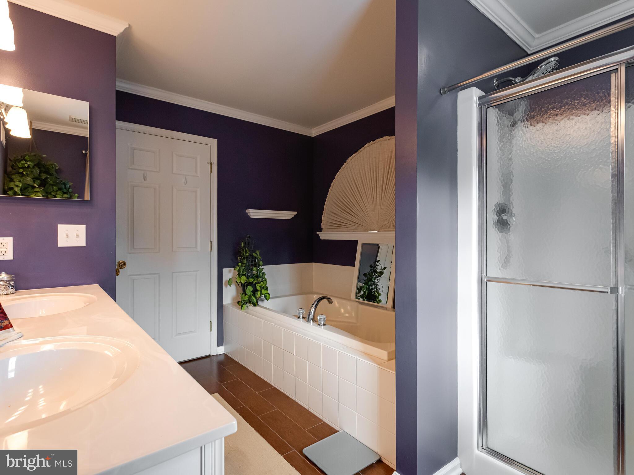 105 Hydrangea Way Coatesville, PA 19320 - Photo 16 of 26 a bathroom with a tub and shower