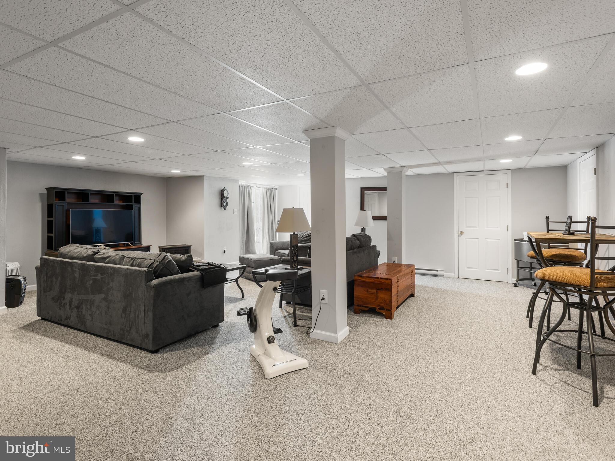105 Hydrangea Way Coatesville, PA 19320 - Photo 21 of 26 a living room with furniture and a flat screen tv