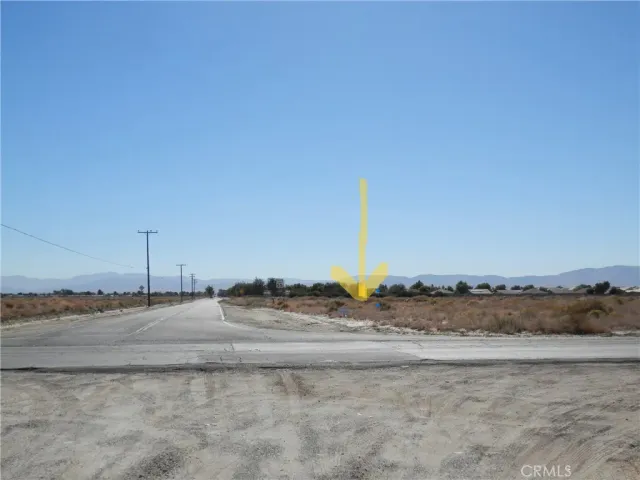 a view of a beach with a road