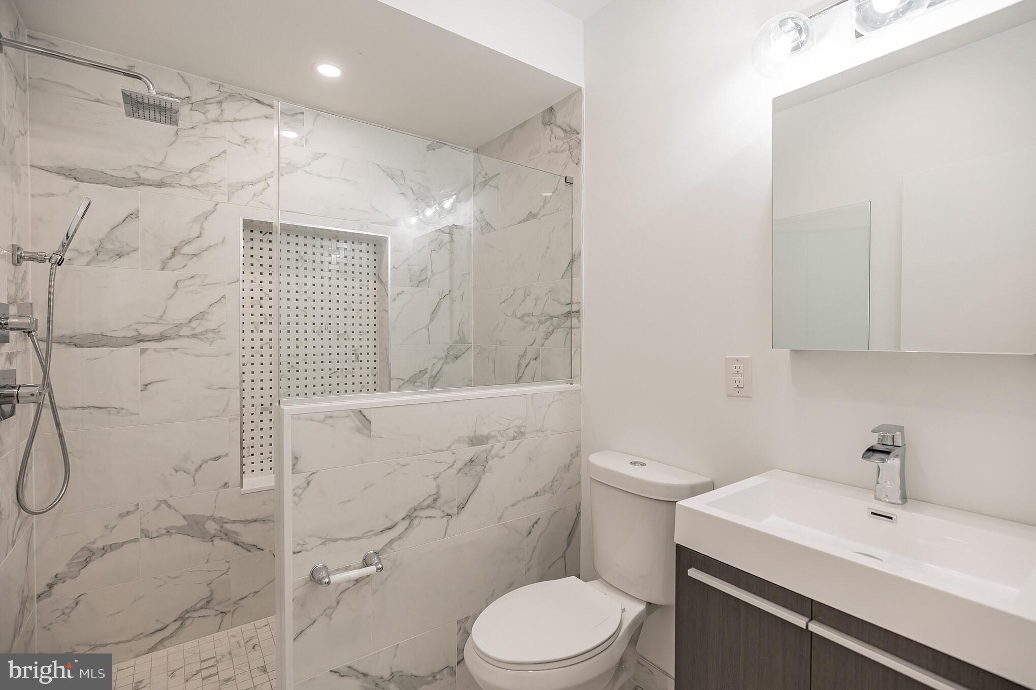 2133 Mifflin Street Philadelphia, PA 19145 - Photo 6 of 6 a bathroom with a sink toilet and shower