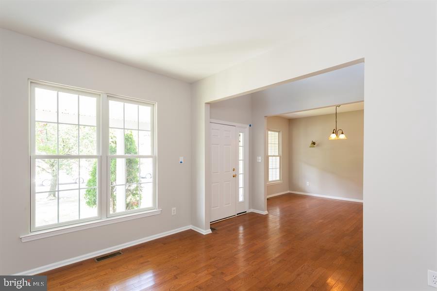 28 Blanchard Road Marlton, NJ 08053 - Photo 2 of 24 wooden floor in an empty room with a window