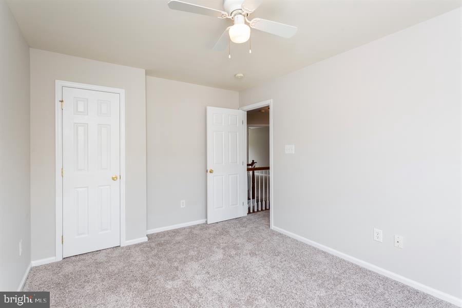 28 Blanchard Road Marlton, NJ 08053 - Photo 15 of 24 an empty room with a ceiling fan and a window