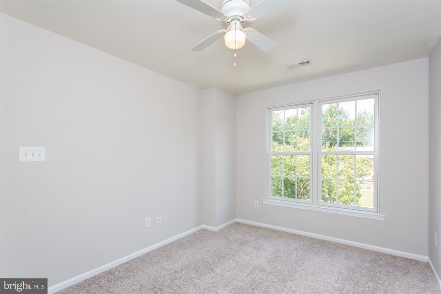 28 Blanchard Road Marlton, NJ 08053 - Photo 19 of 24 an empty room with a window and a fan