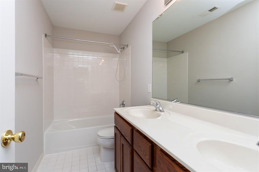 28 Blanchard Road Marlton, NJ 08053 - Photo 22 of 24 a bathroom with a sink a toilet and shower