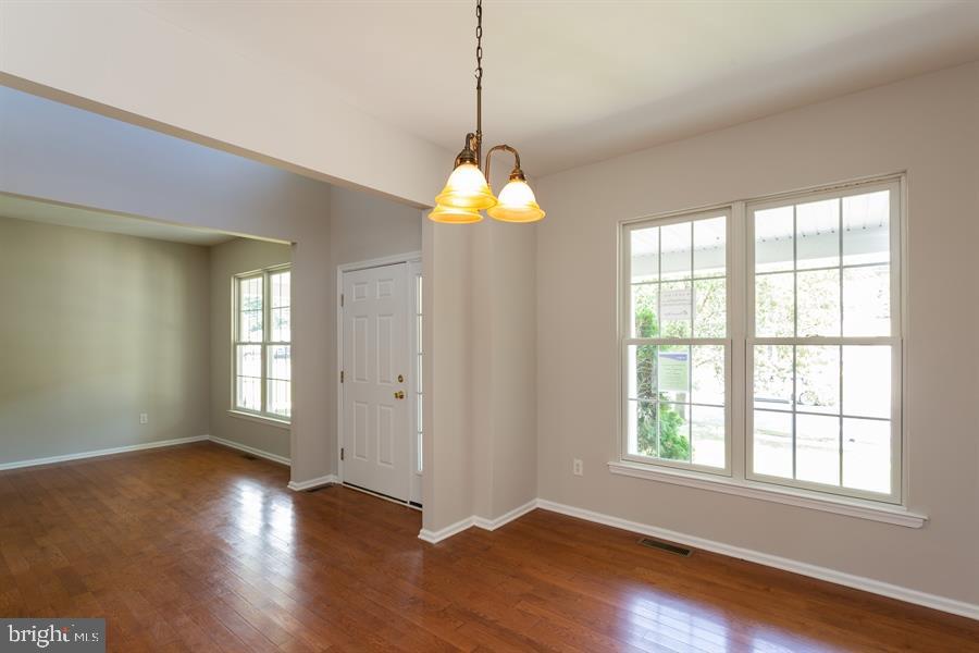 28 Blanchard Road Marlton, NJ 08053 - Photo 4 of 24 a view of an empty room with wooden floor and a window