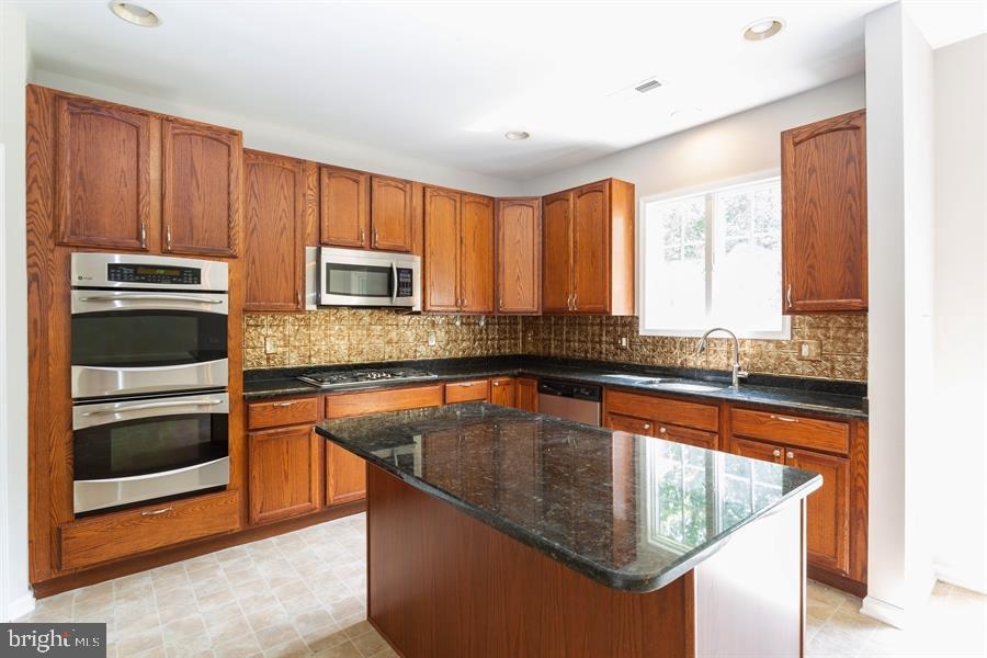28 Blanchard Road Marlton, NJ 08053 - Photo 5 of 24 a kitchen with stainless steel appliances granite countertop a stove sink and microwave
