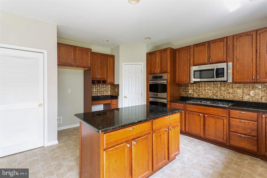 28 Blanchard Road Marlton, NJ 08053 - Photo 6 of 24 a kitchen with stainless steel appliances granite countertop a refrigerator and a stove top oven