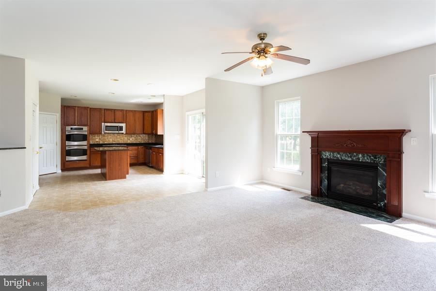 28 Blanchard Road Marlton, NJ 08053 - Photo 7 of 24 a living room with furniture and a fireplace