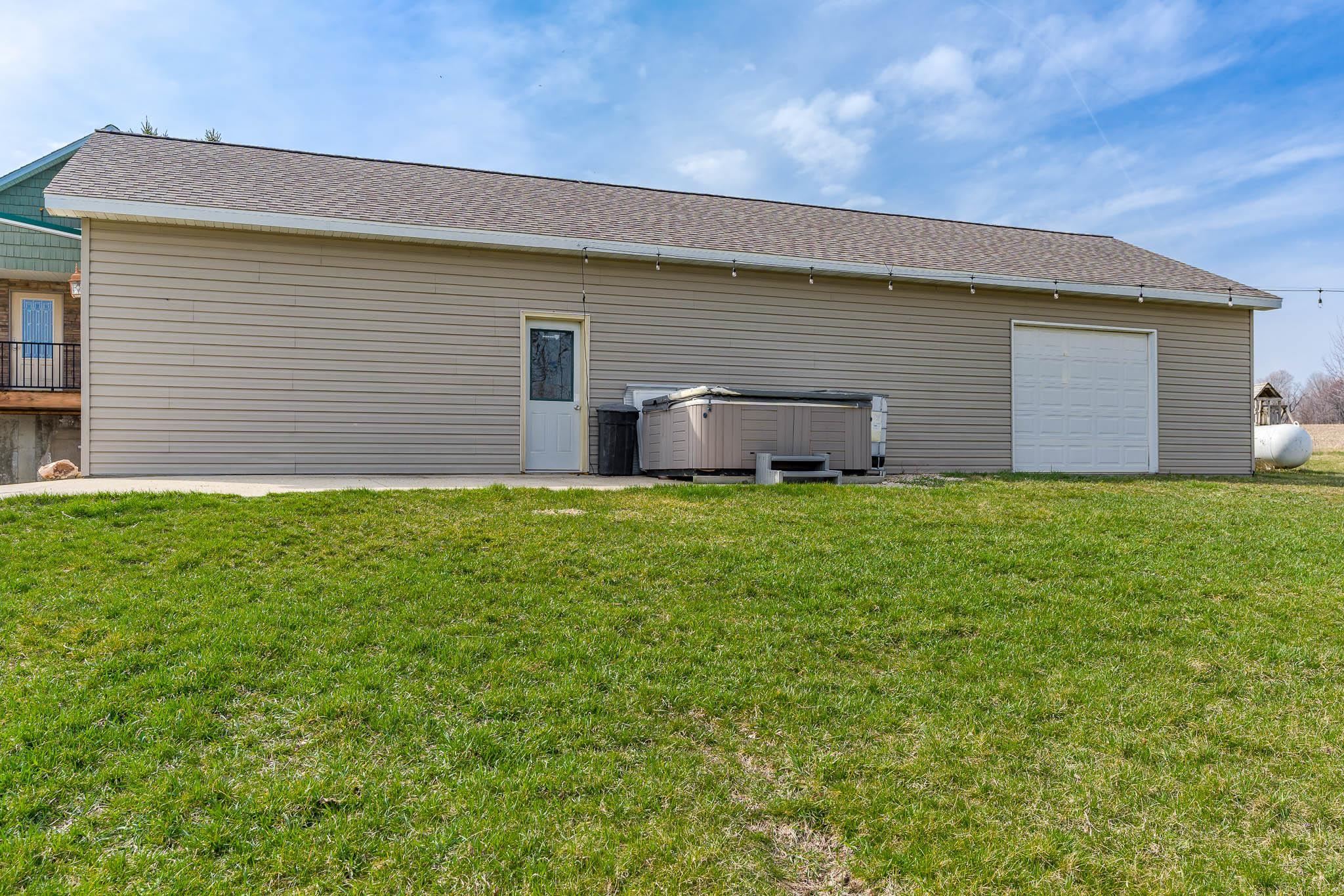 10760 East Rock Grove Road Davis, IL 61019 - Photo 49 of 91 a house view with a garden space