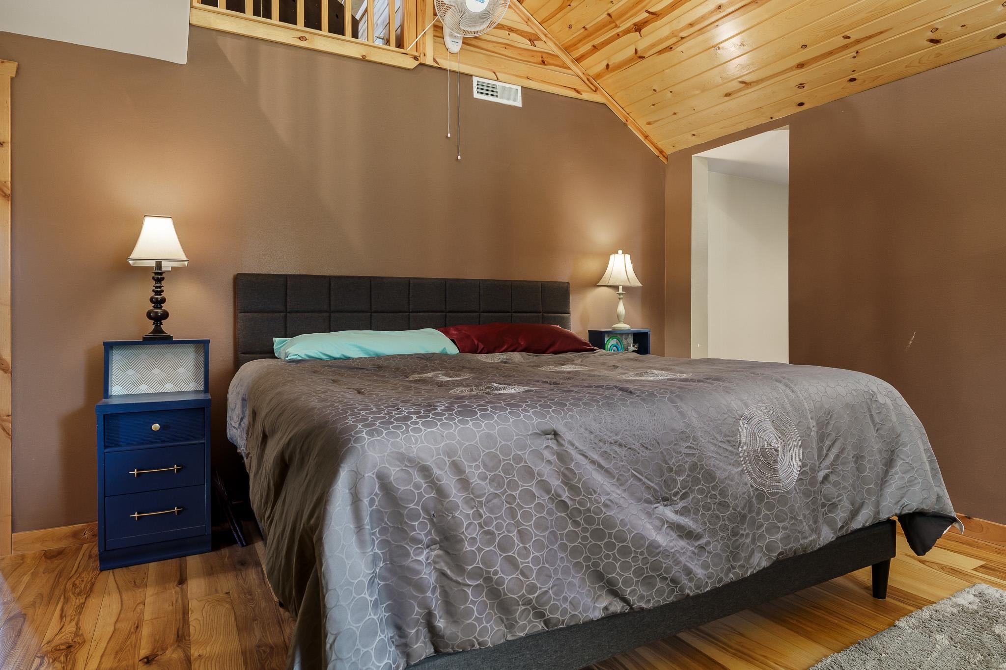 10760 East Rock Grove Road Davis, IL 61019 - Photo 75 of 91 a bedroom with a bed and a lamp