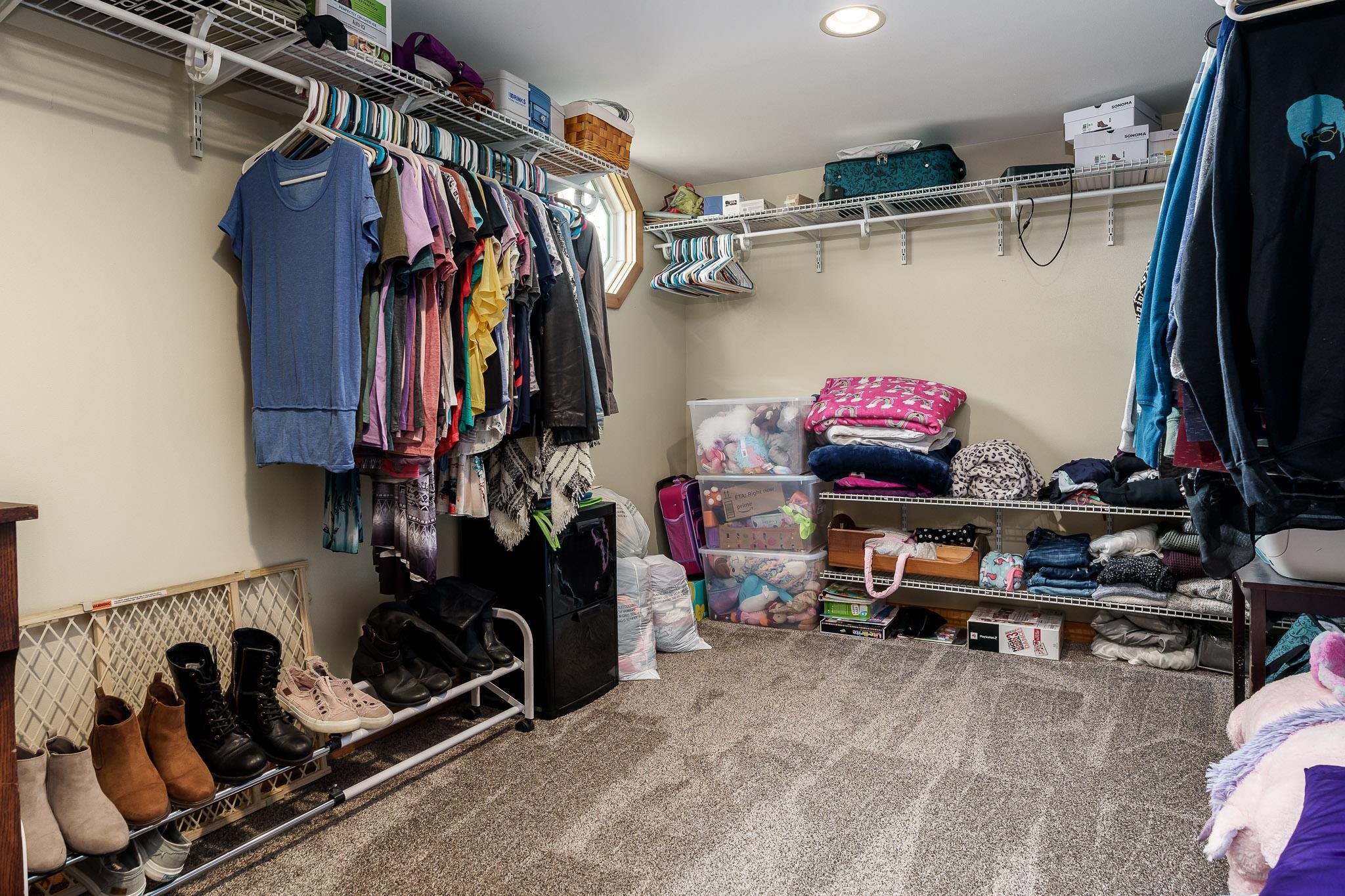 10760 East Rock Grove Road Davis, IL 61019 - Photo 78 of 91 a view of walk in closet with clothes and shoes