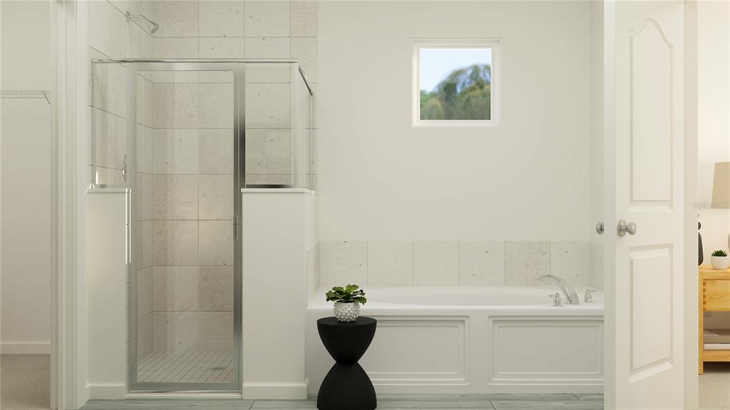 8675 Southwest 69th Terrace Ocala, FL 34476 - Photo 9 of 18 a bathroom with a bathtub and a shower