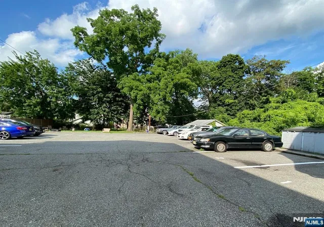 a view of street with parked cars