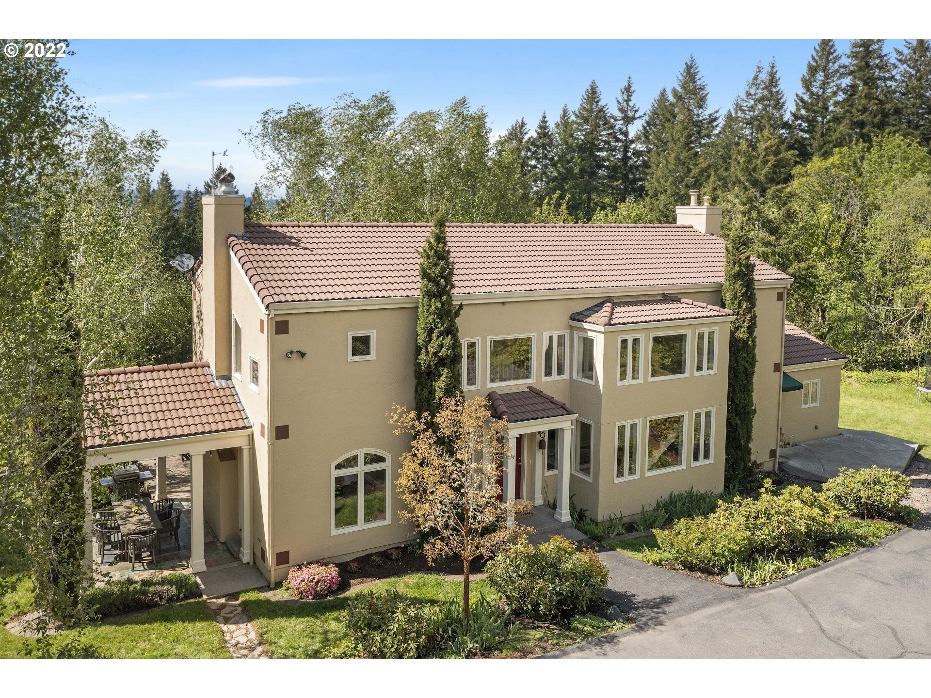 14440 Northwest McNamee Road Portland, OR 97231 - Photo 1 of 32 a view of a house with a yard and potted plants