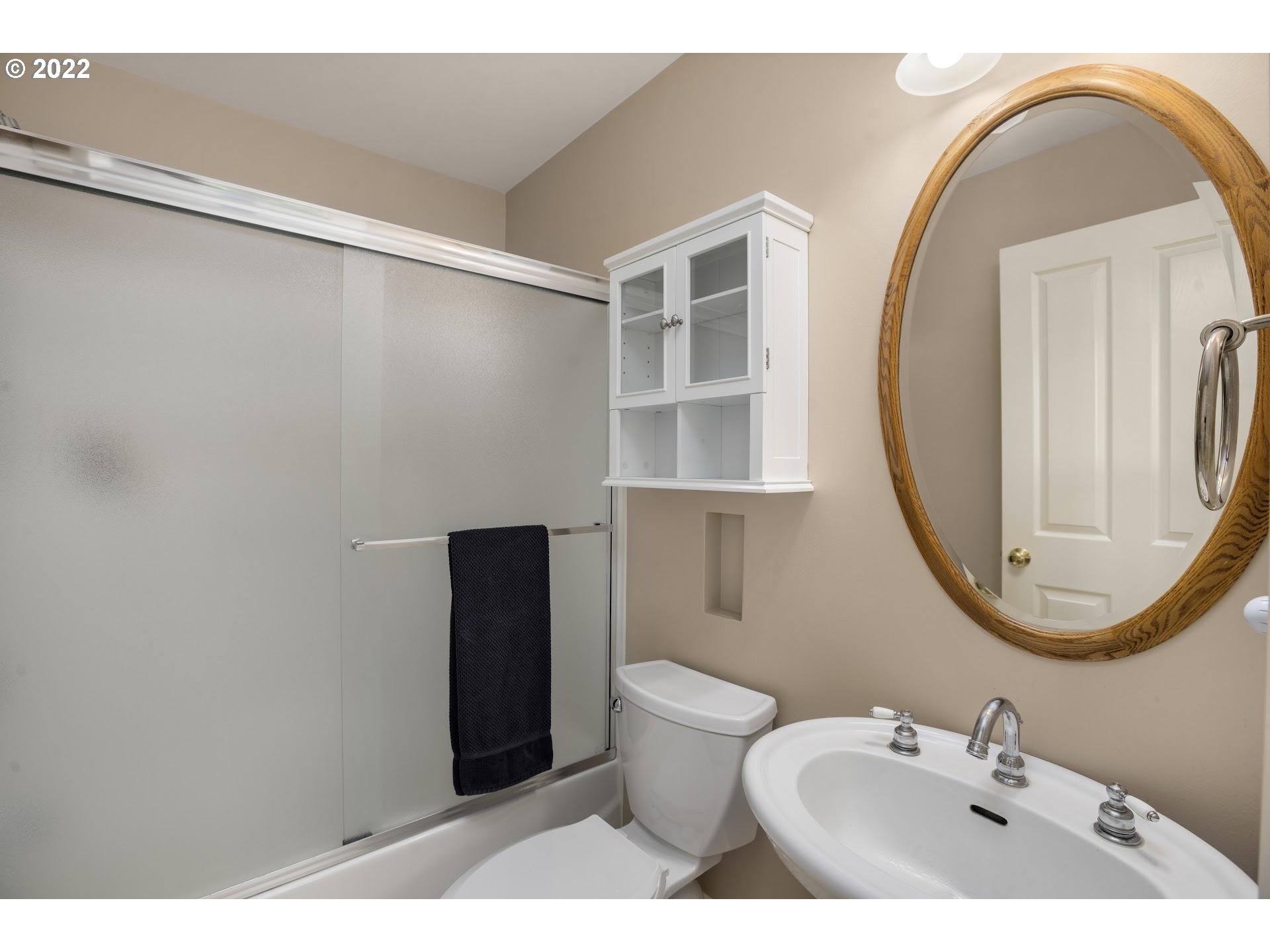 14440 Northwest McNamee Road Portland, OR 97231 - Photo 13 of 32 a bathroom with a sink and a mirror