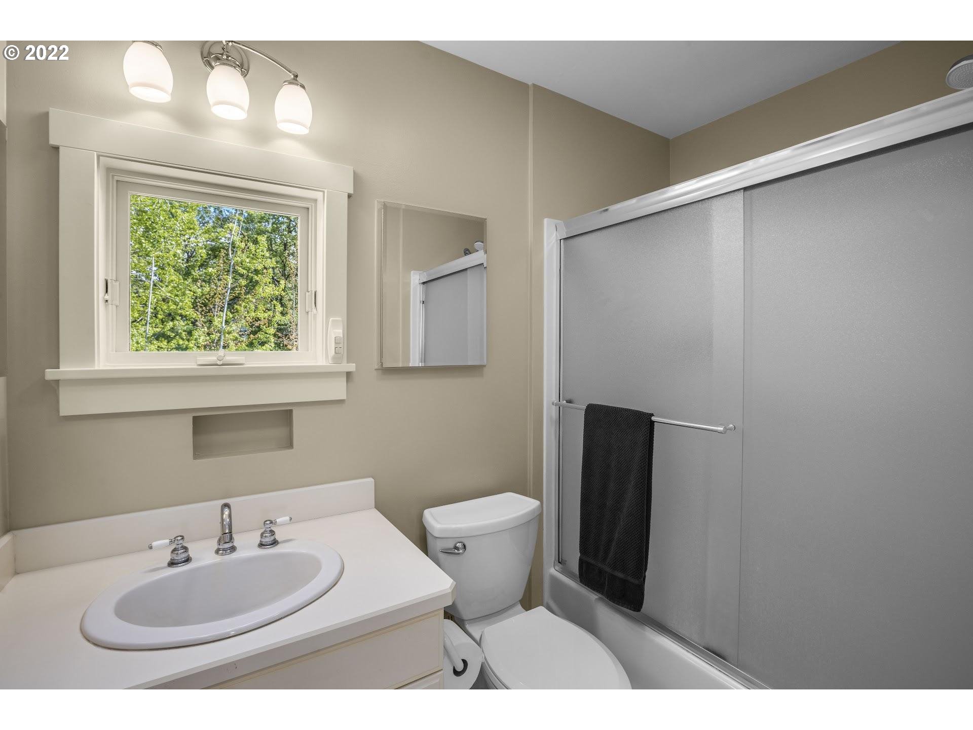 14440 Northwest McNamee Road Portland, OR 97231 - Photo 23 of 32 a bathroom with a sink and a toilet