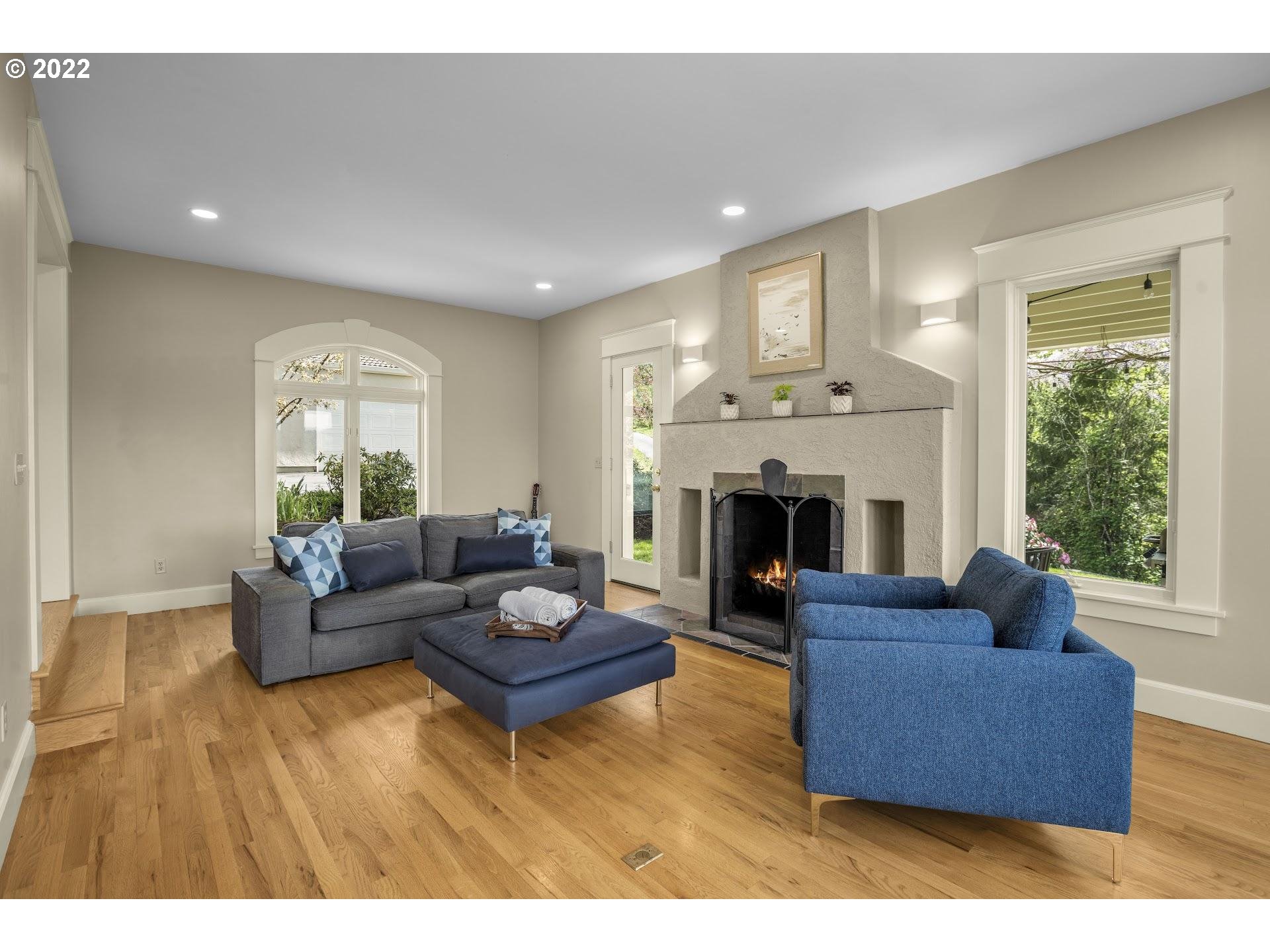 14440 Northwest McNamee Road Portland, OR 97231 - Photo 3 of 32 a living room with furniture and a fireplace