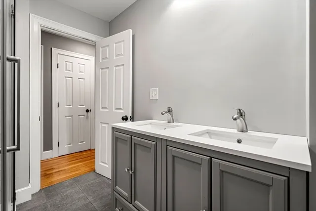 a bathroom with a sink and a mirror