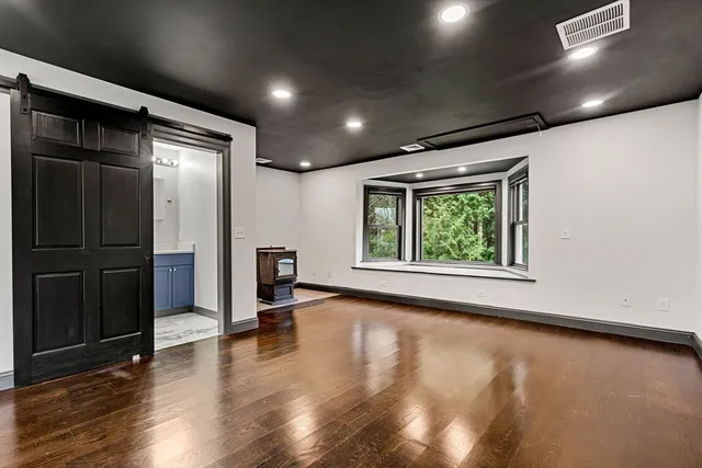 a view of a livingroom with wooden floor