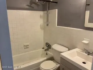a bathroom with a sink toilet and bathtub