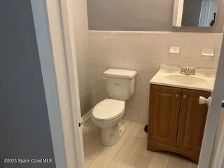 a bathroom with a toilet and a sink