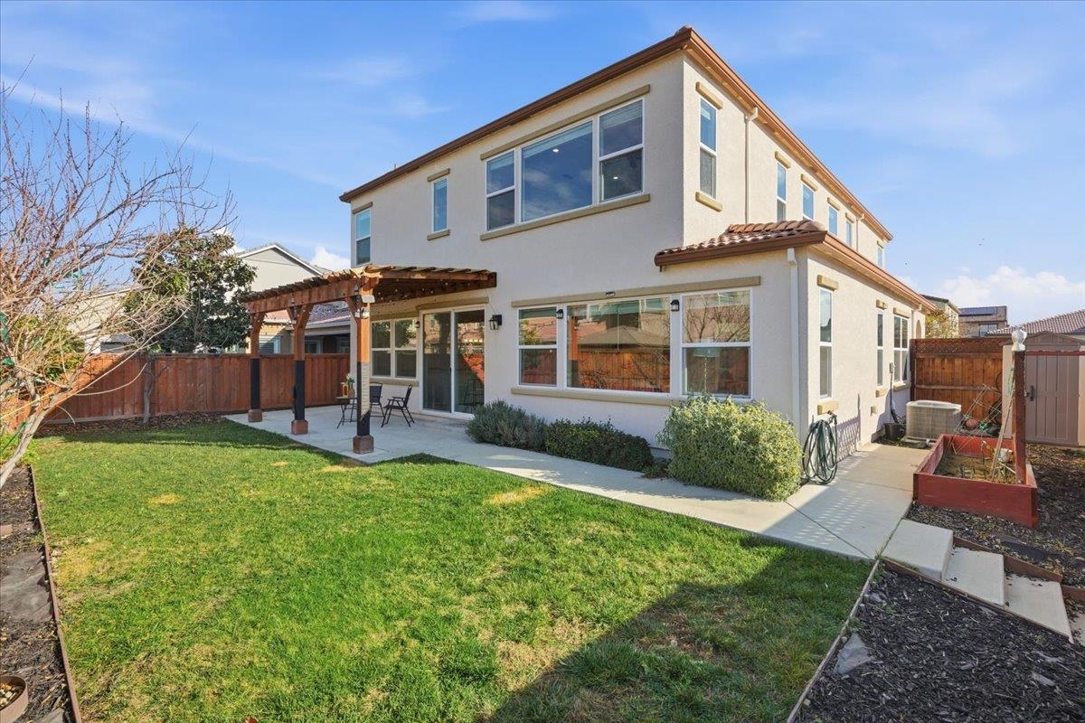 2481 Azalea Avenue Tracy, CA 95376 - Photo 25 of 31 a front view of a house with a yard table and chairs