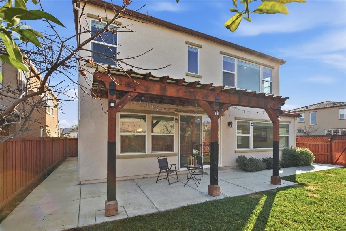 2481 Azalea Avenue Tracy, CA 95376 - Photo 27 of 31 a view of a building with a large window and a yard