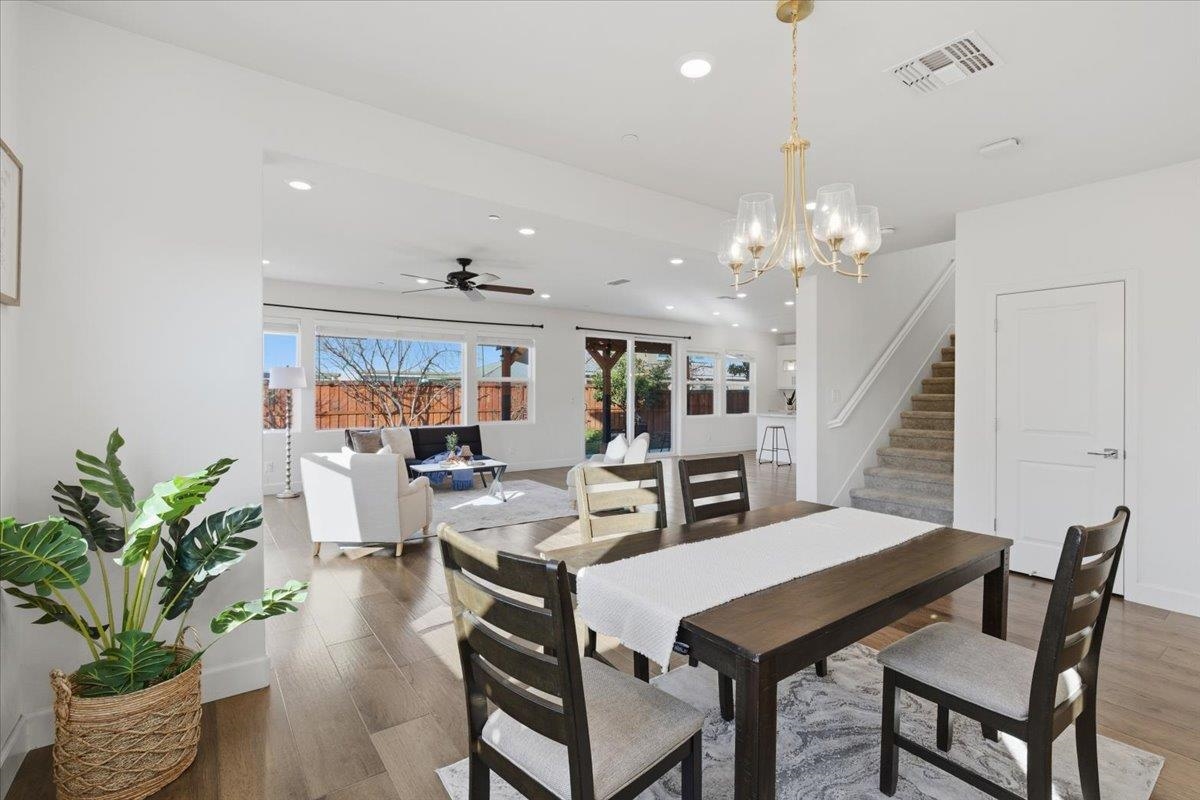 2481 Azalea Avenue Tracy, CA 95376 - Photo 4 of 31 a living room with furniture a chandelier and a chandelier