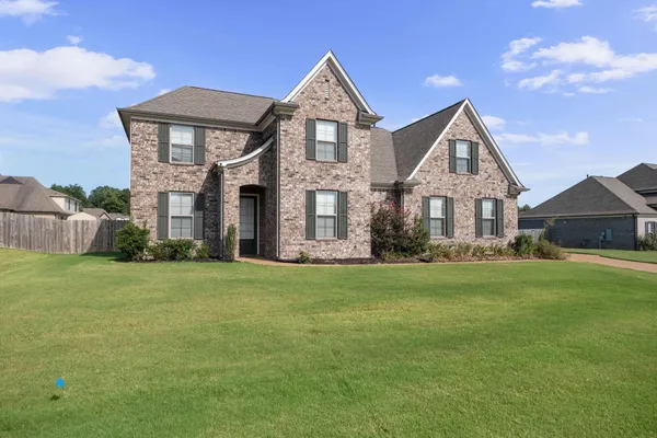 a living room with fireplace furniture and a flat screen tv