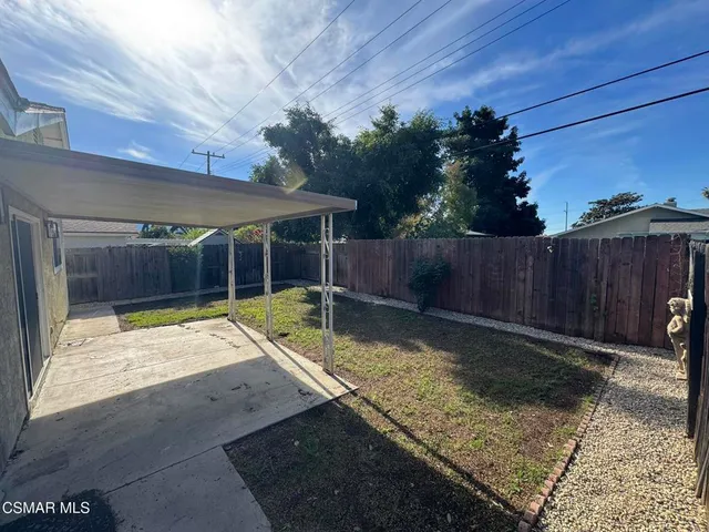 a view of a backyard with a small cabin