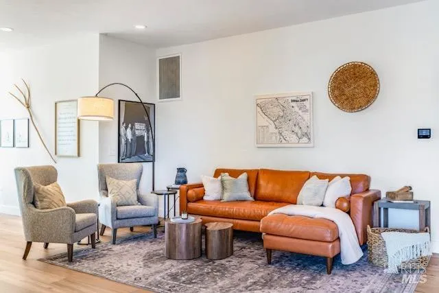 a blue couch sitting inside of a living room