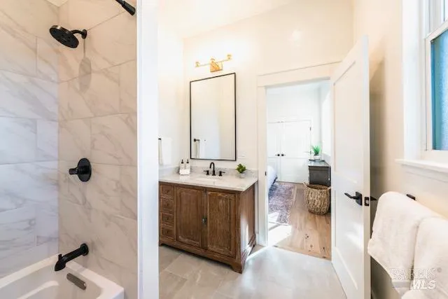 a view of a bathroom with dual sinks