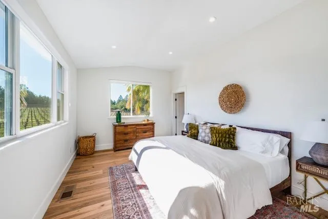 a bedroom with a bed and window