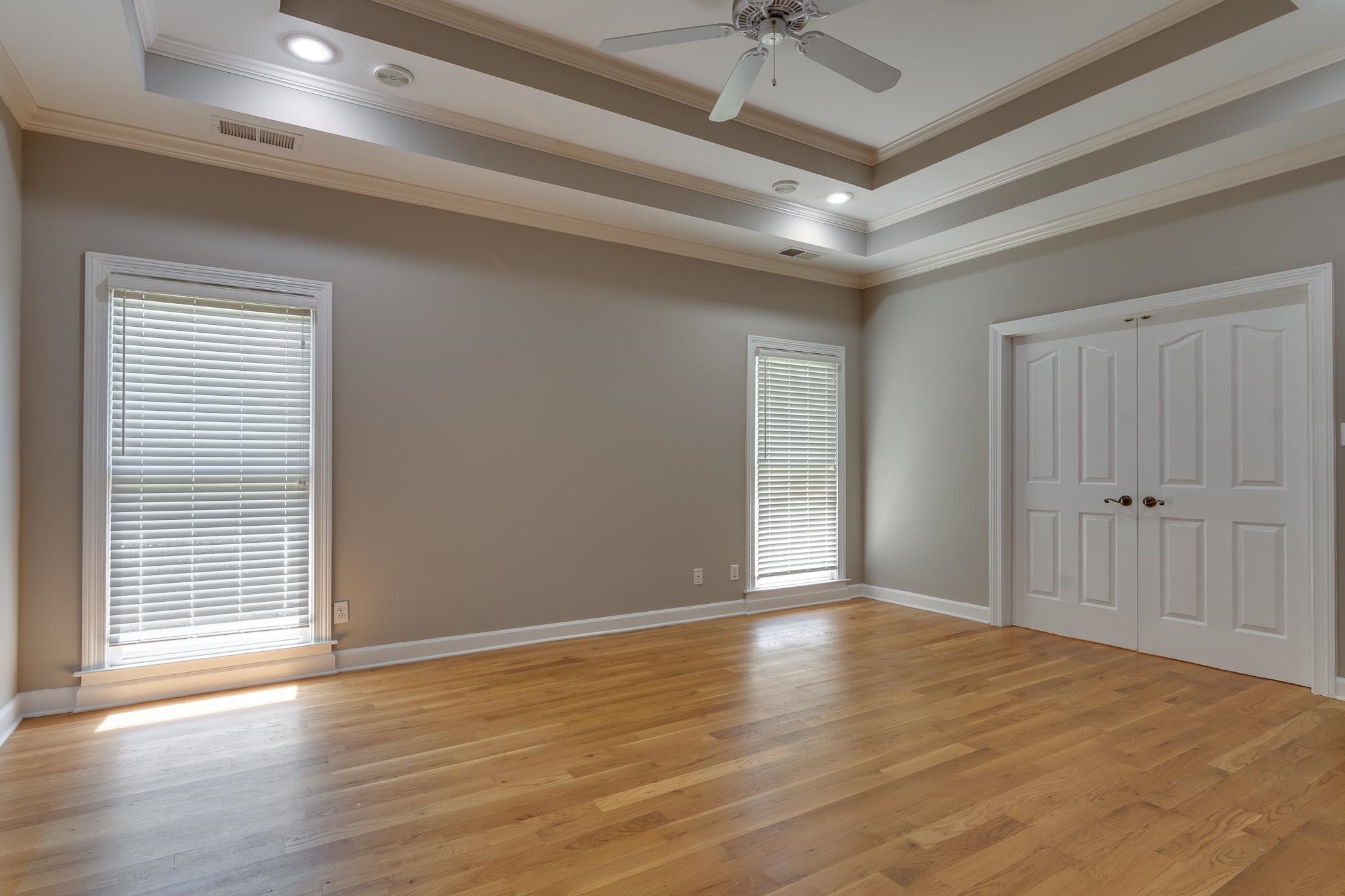 4306 Wind Tree Cove Bartlett, TN 38135 - Photo 17 of 28 a view of an empty room with wooden floor and a window