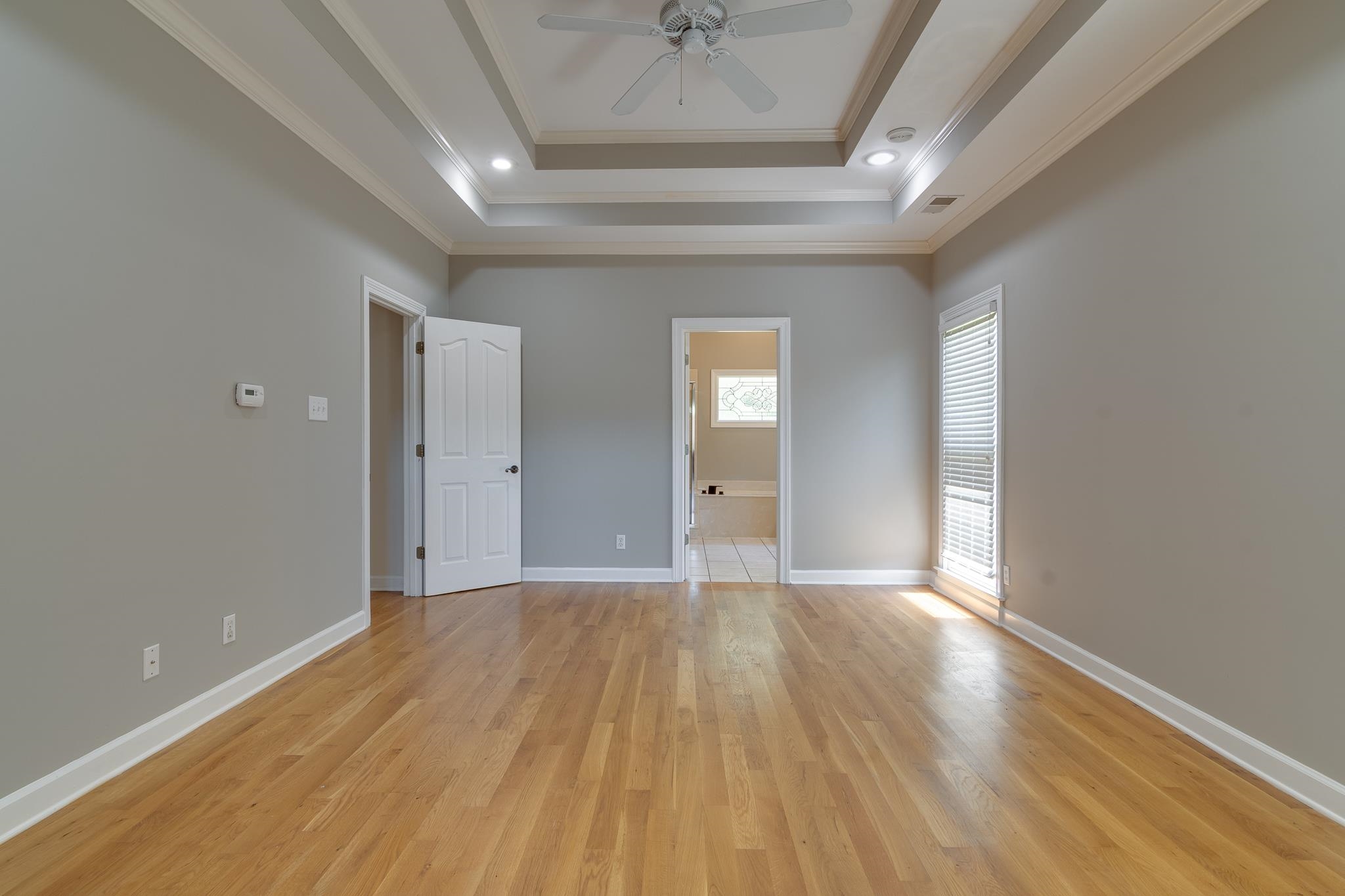 4306 Wind Tree Cove Bartlett, TN 38135 - Photo 20 of 28 wooden floor in an empty room with a window
