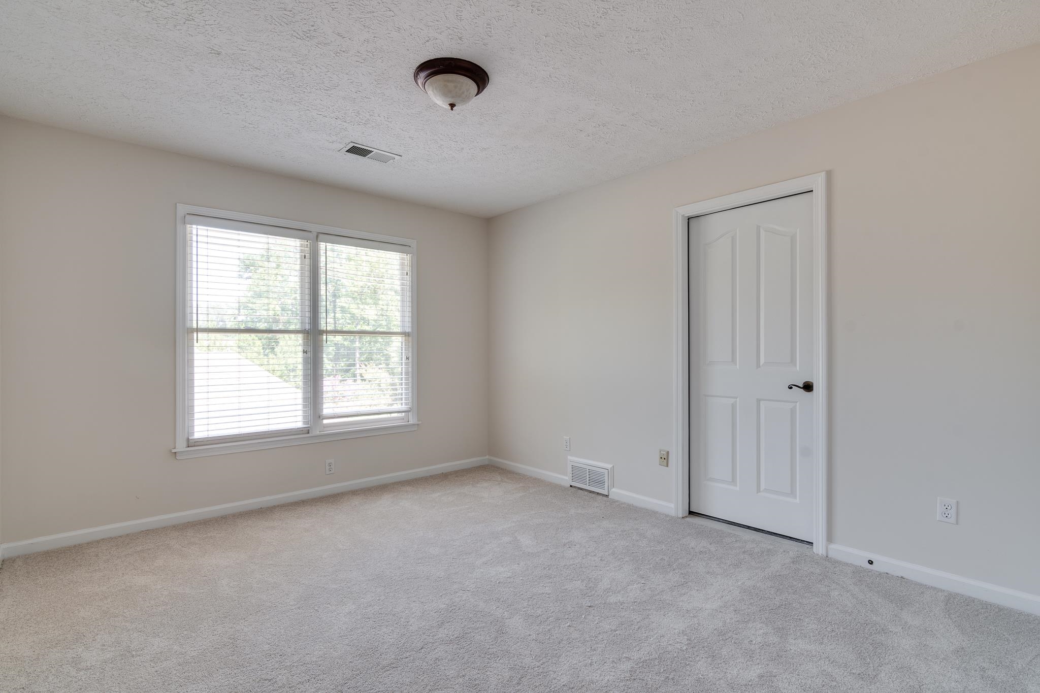 4306 Wind Tree Cove Bartlett, TN 38135 - Photo 24 of 28 an empty room with a window