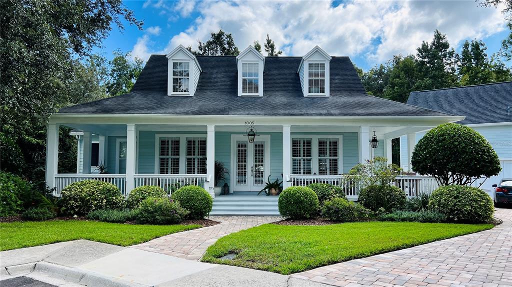 a view of a front of a house with a yard