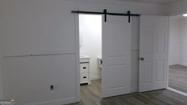 a bathroom with a toilet sink and shower