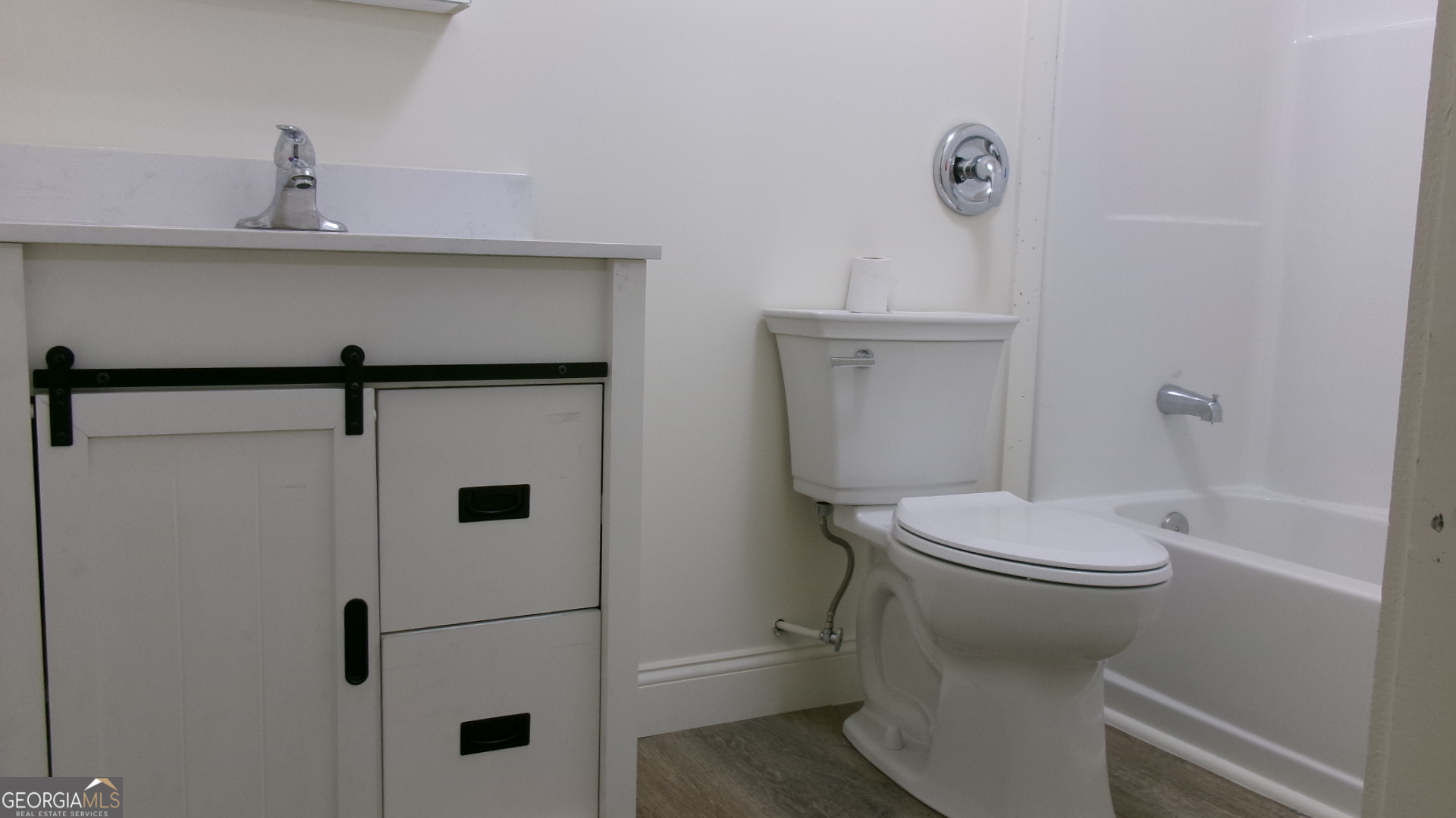17827 Highway 129 Claxton, GA 30417 - Photo 12 of 21 a bathroom with a toilet sink and shower