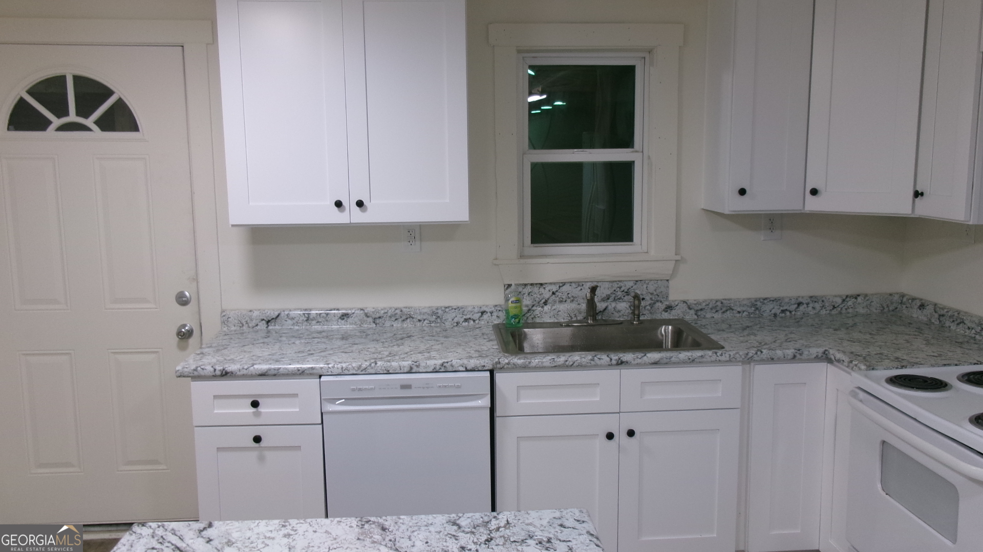 17827 Highway 129 Claxton, GA 30417 - Photo 19 of 21 a kitchen with granite countertop a sink and cabinets