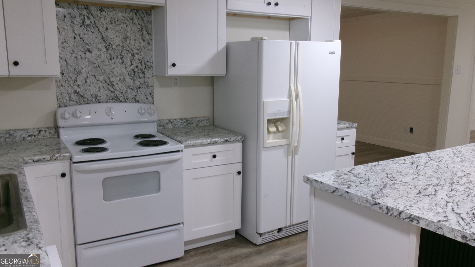 17827 Highway 129 Claxton, GA 30417 - Photo 20 of 21 a kitchen with a stove and a refrigerator