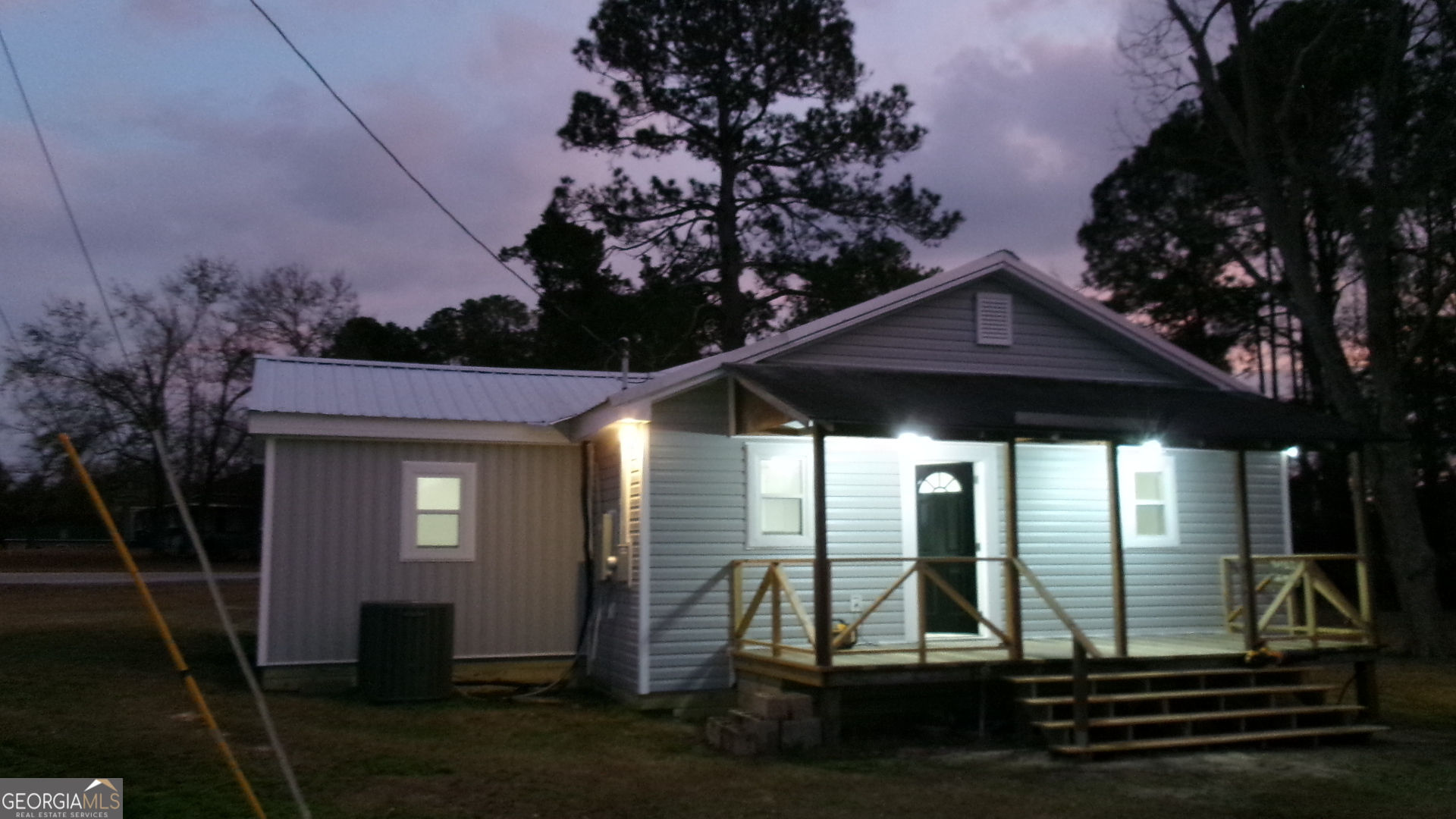 17827 Highway 129 Claxton, GA 30417 - Photo 2 of 21 a view of backyard with plants and large trees