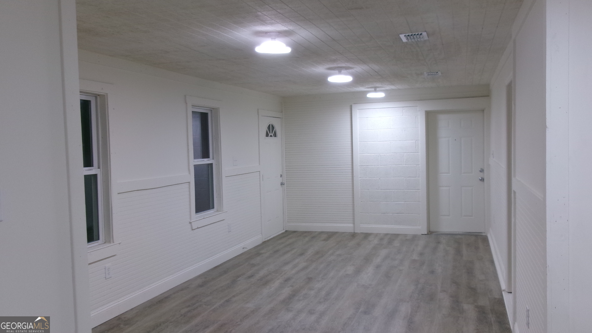 17827 Highway 129 Claxton, GA 30417 - Photo 7 of 21 wooden floor in an empty room