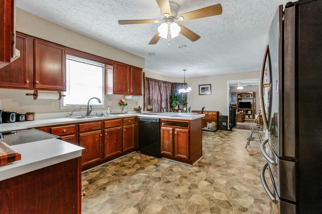 1512 Oak Ridge Court Hopkinsville, KY 42240 - Photo 12 of 24 a kitchen with stainless steel appliances granite countertop a sink stove and refrigerator