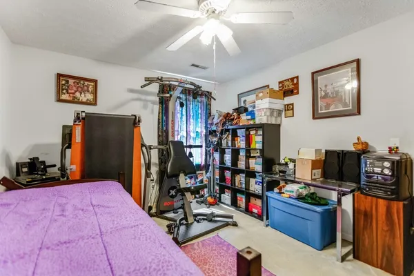 a bedroom with furniture and closet